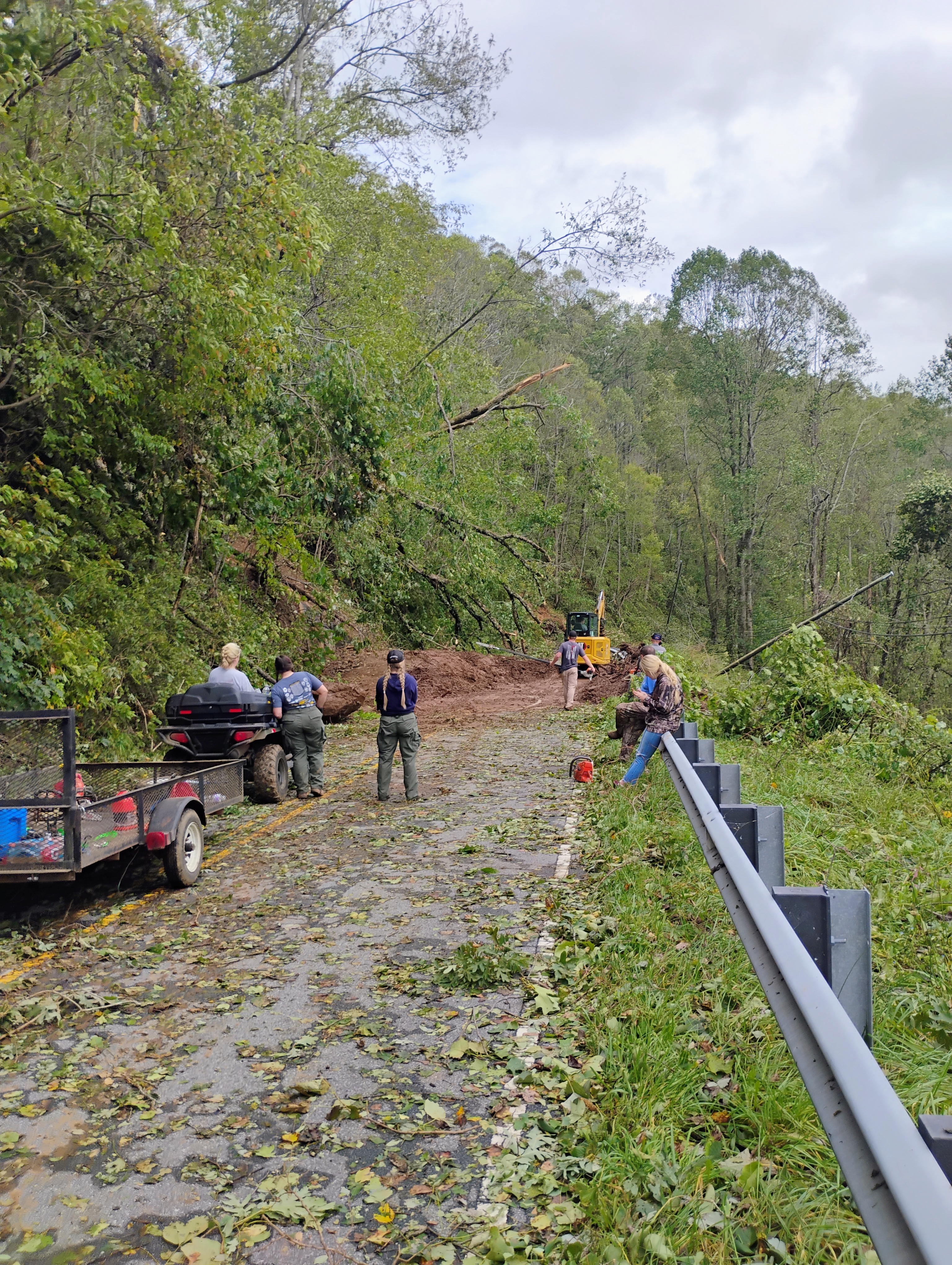 Volunteers clearing debris from Highway 226A